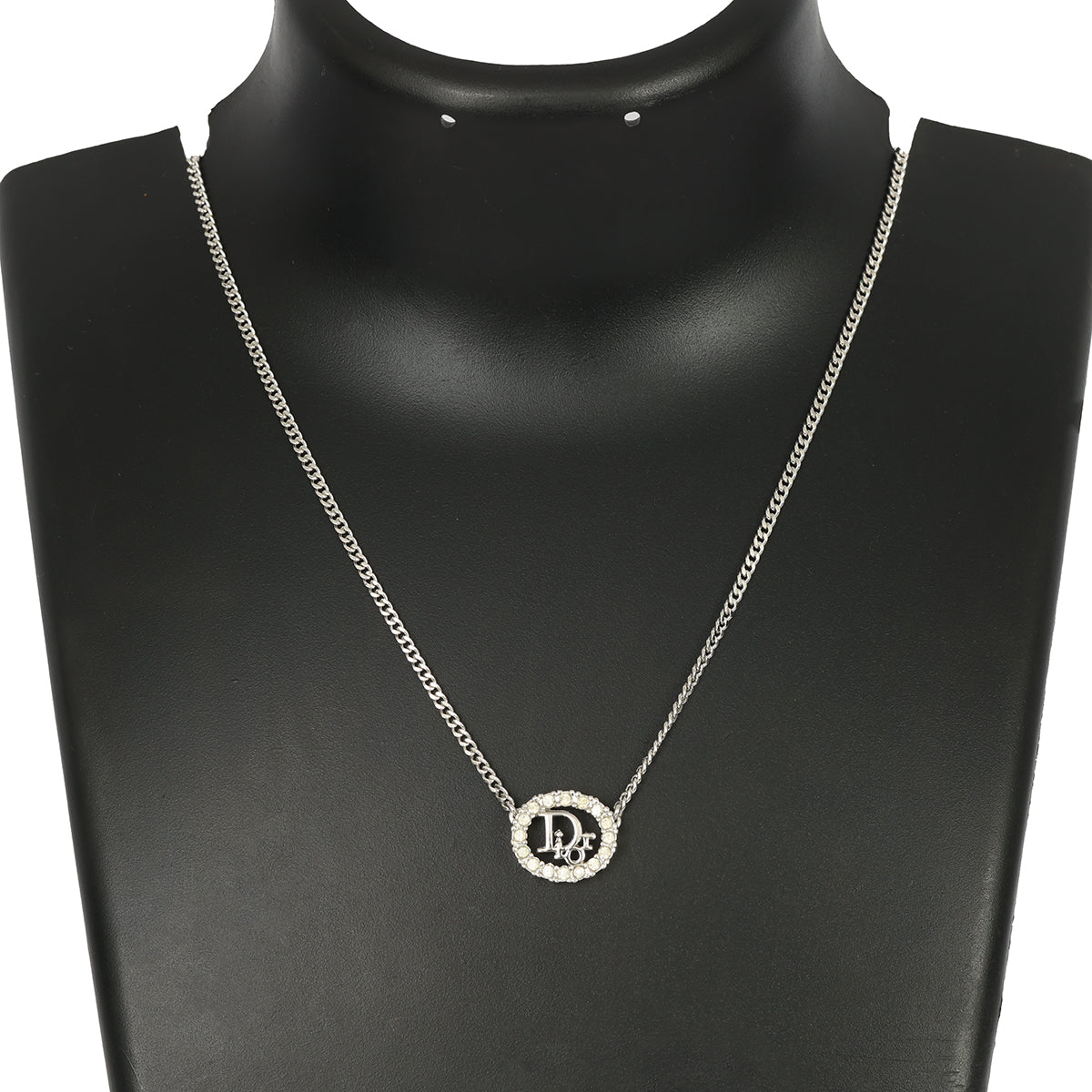 CHRISTIAN DIOR SILVER-TONE OVAL PENDANT WITH CRYSTAL DIOR LOGO