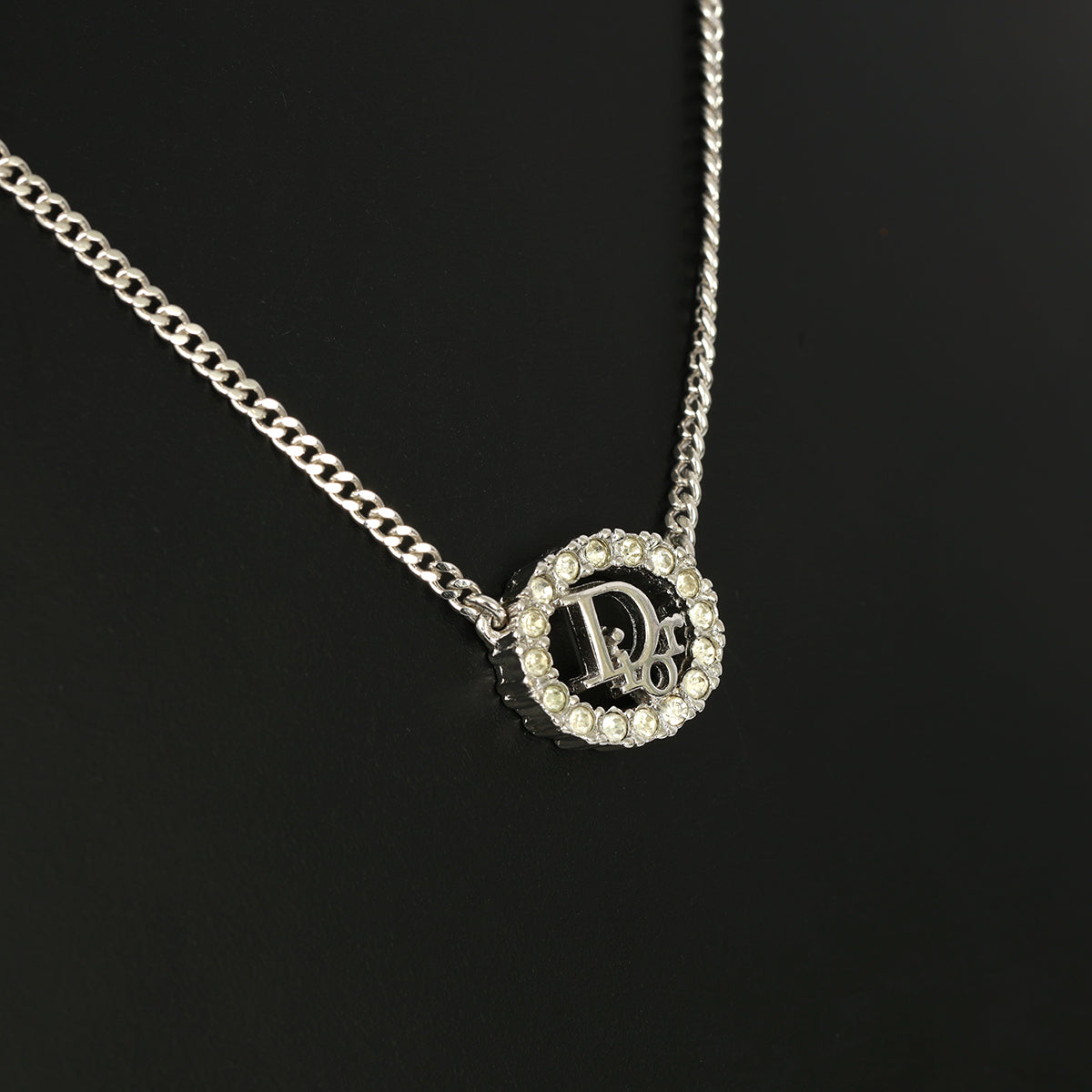 CHRISTIAN DIOR SILVER-TONE OVAL PENDANT WITH CRYSTAL DIOR LOGO