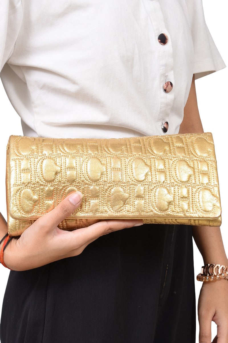 carolina-herrera-bronze-monogram-embossed-clutch