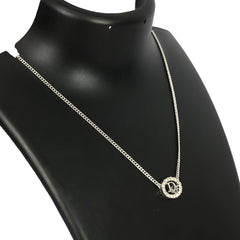 CHRISTIAN DIOR SILVER-TONE  OVAL PENDANT WITH CRYSTAL DIOR LOGO 