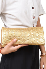 carolina-herrera-bronze-monogram-embossed-clutch
